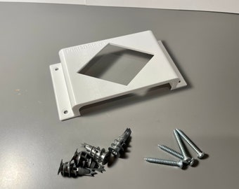 May include: White plastic wall mount with a diamond-shaped cutout and the text "Print3DStavo". The mount is accompanied by several silver screws.