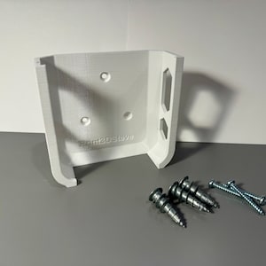 May include: White 3D printed wall mount with the text "Print3DSteve" and three silver screws.