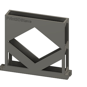 Può includere: Un design geometrico stampato in 3D di colore grigio con un'apertura quadrata e il testo "Print3DSlave" sul davanti.