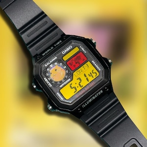 May include: Black Casio digital watch with a yellow and black display. The watch face shows the time, date, and other functions. The watch has a black band and is water-resistant. The watch face also has the text "CASIO" and "ILLUMINATOR".