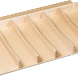 May include: A wooden drawer organizer with six dividers. The organizer is made of light wood and has a natural finish.