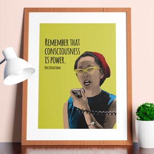 May include: A yellow background with a quote in black text: "Remember that consciousness is power."  The quote is attributed to Yuri Kochiyama. A woman with a red hat and yellow glasses is speaking into a microphone.