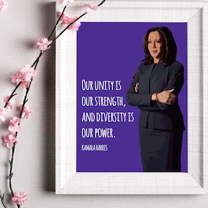 May include: A purple background with a portrait of Kamala Harris, a woman with dark hair and a black suit, with her arms crossed. The text reads "Our unity is our strength, and diversity is our power." with "Kamala Harris" below the text.