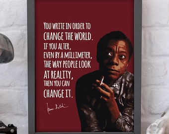 May include: A framed print with a red background featuring a black and white portrait of James Baldwin. The quote "You write in order to change the world. If you alter, even by a millimeter, the way people look at reality, then you can change it." is printed in white text. The quote is signed by James Baldwin.