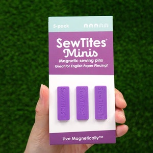 May include: A package of purple magnetic sewing pins called "SewTites Minis". The package says "5-pack" and "Great for English Paper Piecing!"  The text "Live Magnetically™" is at the bottom of the package.