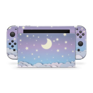 May include: A purple and blue Nintendo Switch console skin with a crescent moon and stars on a cloudy night sky background.
