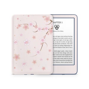 May include: A pink e-reader with a floral design on the cover. The screen displays the text "Chapter 1 Flame of Tar Valon".
