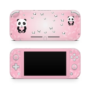 May include: Pink Nintendo Switch Lite console with a panda bear design. The console has a white screen and white buttons. The back of the console has a pink background with panda bear footprints and panda bear faces.