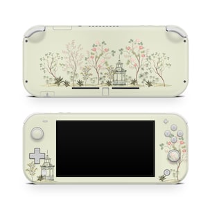 May include: A cream-coloured handheld gaming console with a floral and pagoda design. The design features pink and red flowers, green foliage, and a small pagoda. The console has white accents and a black screen.