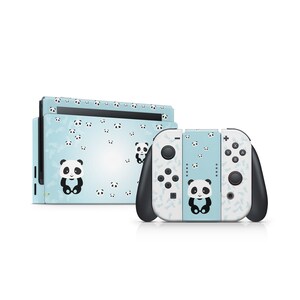 May include: A blue and white Nintendo Switch console and two controllers with a panda bear pattern. The console and controllers are decorated with a repeating pattern of small panda bears.