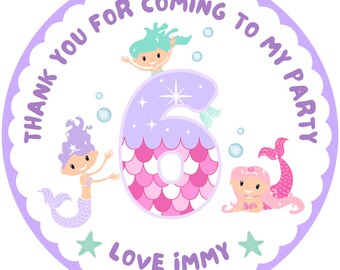 May include: Purple and pink thank you for coming to my party circle sticker with a mermaid and the number 6. The text "Thank you for coming to my party" is written around the outside of the circle. The text "Love immy" is written at the bottom of the circle.
