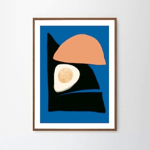 A blue abstract art poster on a wooden frame. The art print has organic shapes with the color combination of pink black and white with a bright blue background. Perfect for a mid century modern minimalist home.