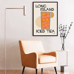 May include: A framed poster with a retro design featuring a glass of iced tea with a lime wedge and the text "Long Island Iced Tea 1920".