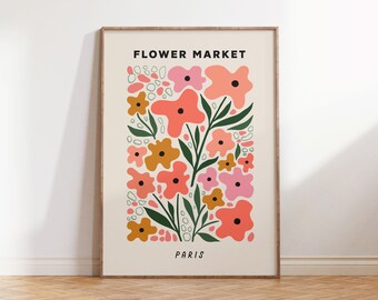 May include: A printable art print with a floral design. The print features pink, orange, and yellow flowers with green leaves. The text "FLOWER MARKET PARIS" is at the top and bottom of the print.