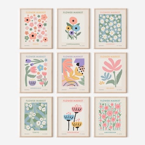May include: Nine colorful floral prints with the text "FLOWER MARKET" above each image. Each print features a different city name: Seoul, Copenhagen, London, Honolulu, Madrid, Milan, Tokyo, Stockholm, and Amsterdam.