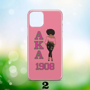 May include: Pink phone case featuring a black silhouette of a woman wearing a pink top and jeans. The letters AKA are in pink with green outlines and the year 1908 is in green with pink outlines.