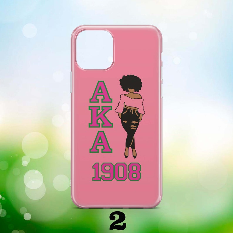 May include: Pink phone case featuring a black silhouette of a woman wearing a pink top and jeans. The letters AKA are in pink with green outlines and the year 1908 is in green with pink outlines.