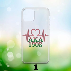 May include: Clear phone case featuring a pink and green heartbeat design. The design includes a heart and the text "AKA 1908".