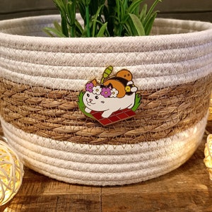 An Enamel Pen featuring a Fat Cat from the game Final Fantasy XIV Online in summer theme