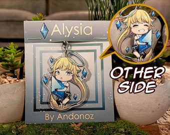 May include: A clear acrylic keychain featuring a cartoon character with blonde hair, a blue halo, and a blue crystal. The character is holding a blue crystal and is surrounded by smaller blue crystals. The keychain is on a white card with the text "Alysia" and "By Andonoz". The other side of the keychain shows the same character holding a blue crystal.