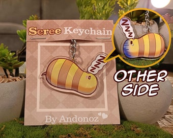 May include: A yellow and brown cartoon bee keychain with a sleepy face and a speech bubble that says "zzz". The keychain is on a pink and white card with the text "Scree Keychain" and "By Andonoz".