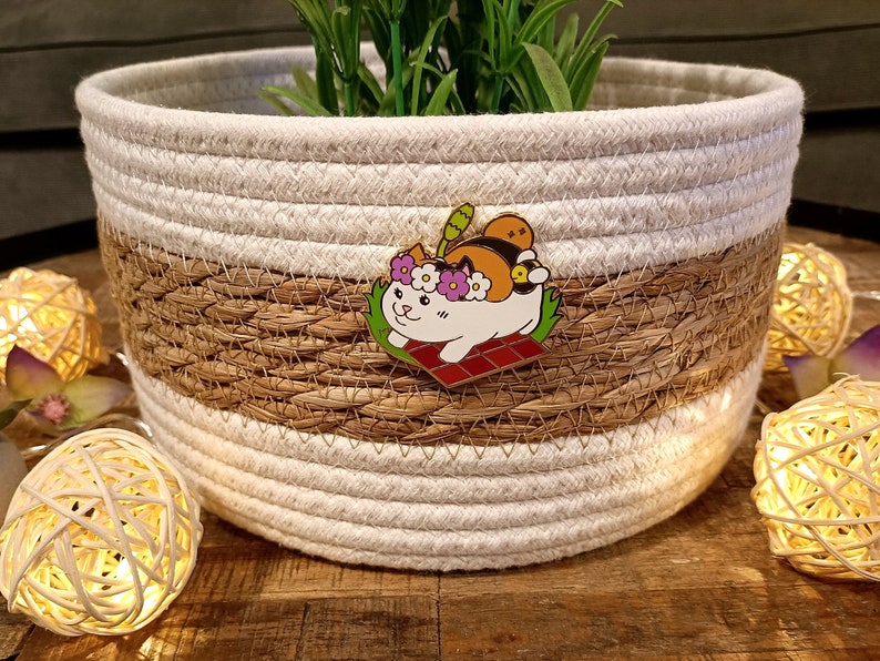 An Enamel Pen featuring a Fat Cat from the game Final Fantasy XIV Online in summer theme