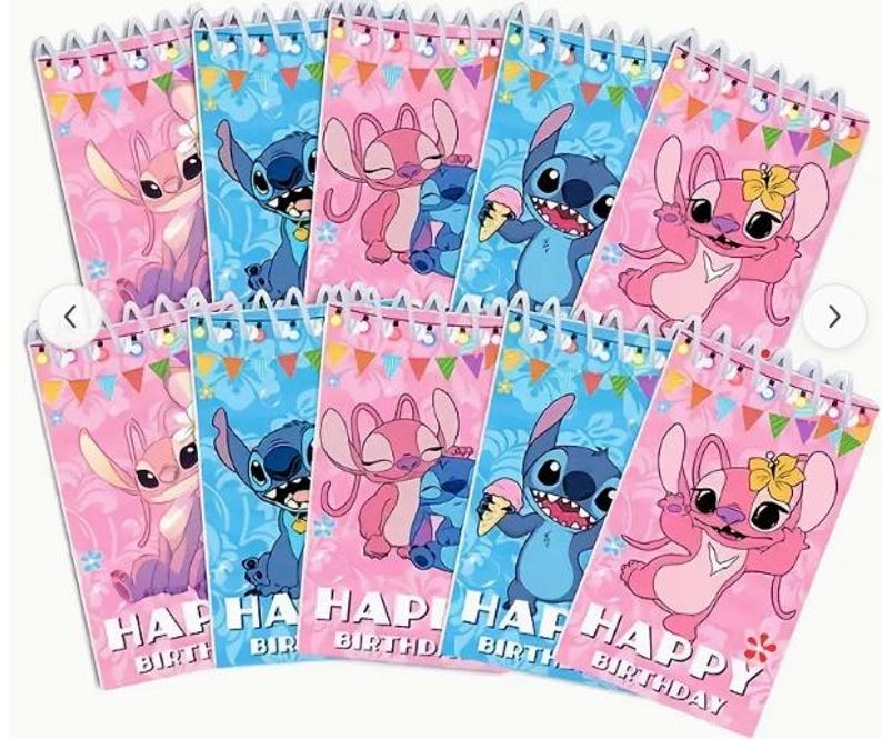 May include: A collection of spiral-bound notebooks featuring the characters Stitch and Angel from Lilo & Stitch. The notebooks have pink and blue backgrounds with the words "Happy Birthday" printed on them. The notebooks are decorated with colorful bunting.