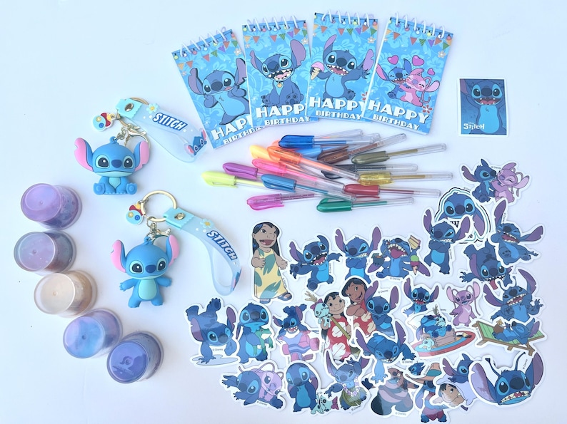 May include: A collection of Stitch-themed party supplies and stationery. Includes blue Stitch figurines, keychains, stickers, notebooks with "Happy Birthday" text, and colorful gel pens. Various shades of blue, purple, and yellow are present.