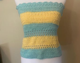 May include: A crocheted tube top with alternating stripes of light blue and yellow.
