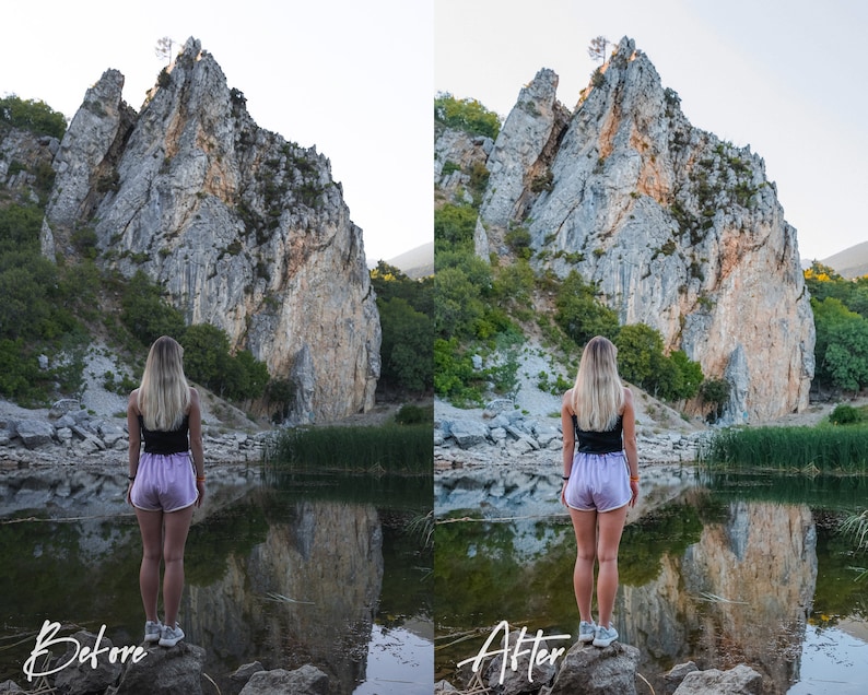 May include: A woman wearing pink shorts and a black vest top stands on a rock by a lake, looking at a large rock formation in the distance. The lake is calm and reflects the sky and the rock formation.