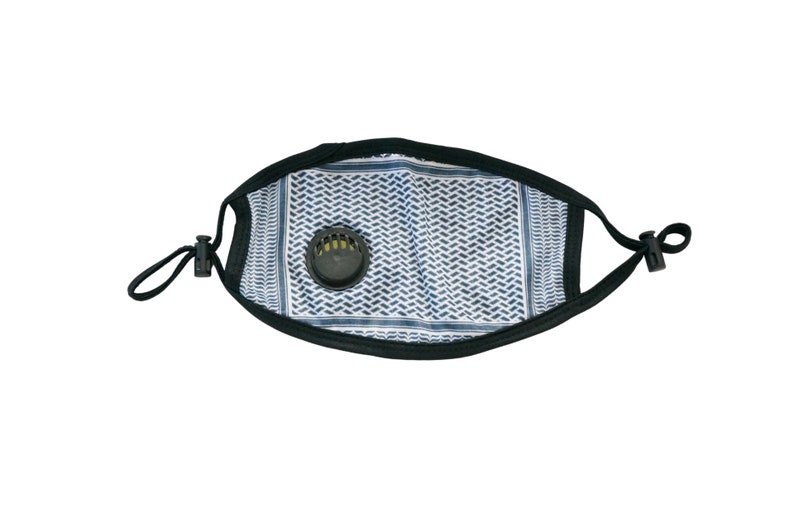 May include: A black face mask with a white and blue patterned design. The mask has a black valve on the front.