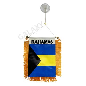 May include: A small car flag with the flag of the Bahamas. The flag is blue, yellow, and black with the words "Bahamas" printed in black at the top. The flag is attached to a suction cup and has a fringe around the edges.