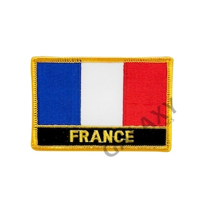 May include: A blue, white, and red embroidered patch with a gold border and the word "FRANCE" in gold lettering on a black background.