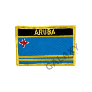 May include: A yellow embroidered patch with the word "ARUBA" in black lettering and the flag of Aruba, featuring a blue background with a red star and two yellow stripes.