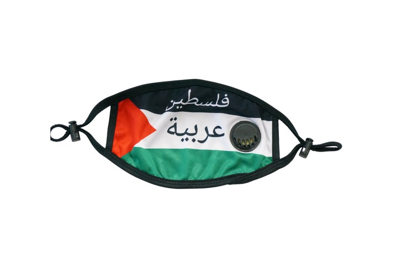 May include: Black face mask with a Palestinian flag design. The flag features red, white, and green stripes with a black triangle in the upper left corner. The mask has a black elastic band and a black valve on the right side. The Arabic text on the mask reads "فلسطين" and "عربية".