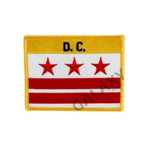 May include: A yellow and white embroidered patch with three red stars and two red stripes. The text "D.C." is in black lettering on a yellow background.