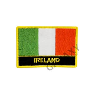 May include: An embroidered patch with the Irish flag and the word "IRELAND" in gold lettering on a black background. The patch has a yellow border.
