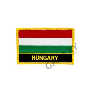 May include: A yellow embroidered patch with the Hungarian flag and the word "HUNGARY" in yellow lettering on a black background.