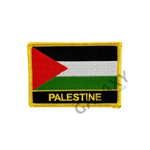 May include: An embroidered patch with the Palestinian flag. The flag is black, white, green, and red with a triangle in the upper left corner. The patch has a gold border and the word "PALESTINE" in gold lettering.