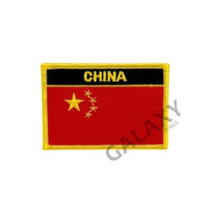 May include: A red and yellow embroidered patch with the word "CHINA" in black lettering and a yellow five-pointed star with four smaller stars in a circle around it.