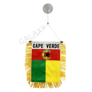 May include: A small car flag with a yellow fringe. The flag features the flag of Cape Verde with the words "Cape Verde" printed in white at the top.