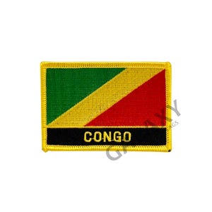 May include: Embroidered patch featuring the flag of the Democratic Republic of the Congo. The patch is yellow with a green, yellow, and red diagonal stripe. The words "CONGO" are printed in black on a black background.