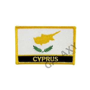 May include: A yellow and white embroidered patch with the flag of Cyprus and the word "CYPRUS" in black lettering.