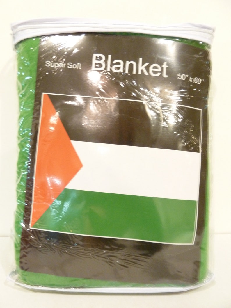 May include: A green, white, and black blanket with the words "Super Soft Blanket 50"x"60" printed on the packaging.