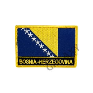 May include: A yellow embroidered patch featuring the flag of Bosnia and Herzegovina. The flag depicts a blue triangle with white stars on a yellow background. The text "BOSNIA-HERZEGOVINA" is written in black below the flag.