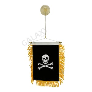 May include: A black pirate flag with a white skull and crossbones design. The flag has yellow fringe and is hanging from a suction cup.