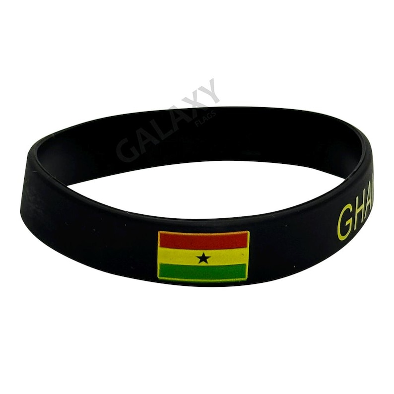 May include: Black silicone bracelet with the flag of Ghana and the word "Ghana" printed in yellow.