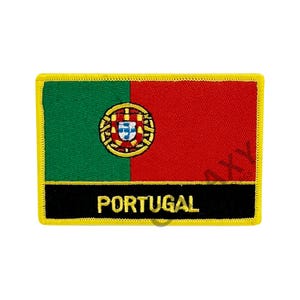 May include: A rectangular patch featuring the flag of Portugal. The flag is divided vertically into green and red sections, with the Portuguese coat of arms in the center. The word "PORTUGAL" is displayed in gold letters on a black banner.