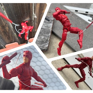 May include: A collage of four images featuring a red action figure of the superhero Daredevil. The figure is in various dynamic poses, holding his signature billy clubs. The figure is wearing a red suit and mask.