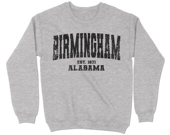以下が含まれることがあります： グレーのトレーナーに、黒い文字で「BIRMINGHAM EST. 1871 ALABAMA」と書いてあります。